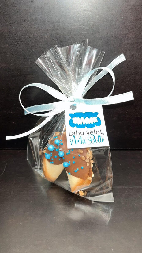 Fortune cookie with chocolate in a bag with a ribbon and card