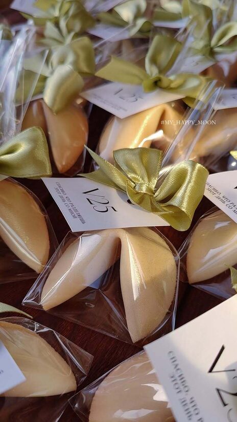 Fortune cookies in bags with ribbons and cards