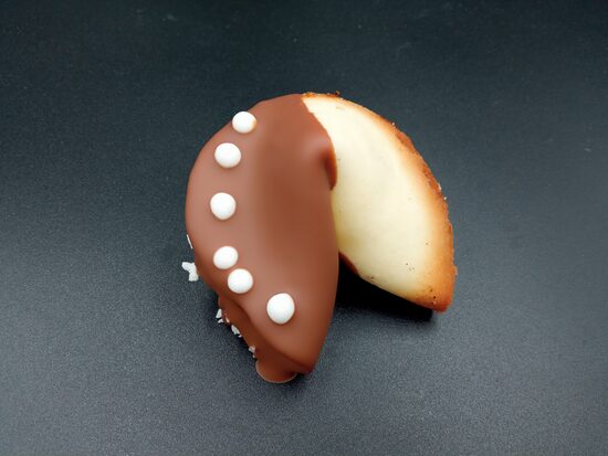Fortune cookie with chocolate in a bag