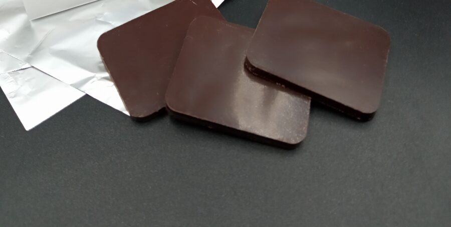 Credit card sized chocolate in foil or transparent bag without print