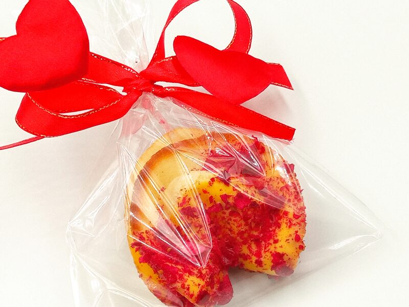 Fortune cookie with chocolate in a bag with a ribbon
